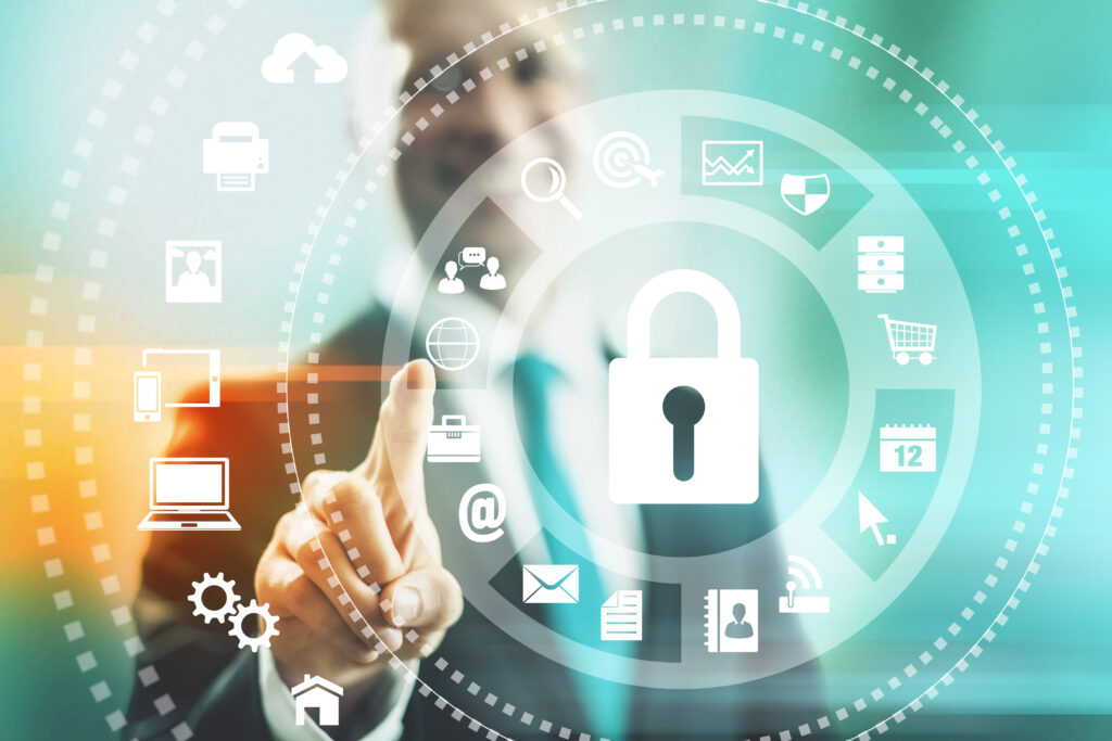 A person in a suit touches a virtual screen displaying a padlock and various digital security and technology icons.